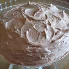  Коржи промазать шоколадным кремом.Часть крема нанести на поверхность торта.Поставить в холодильник на 3-4 часа.