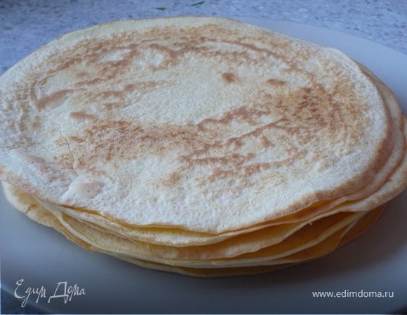 Добавить в тесто минеральной воды, и в 1 ст.л. горячего масла испечь блины. Получается 7 блинов. Я использовала из них только 6, один прозапас :)