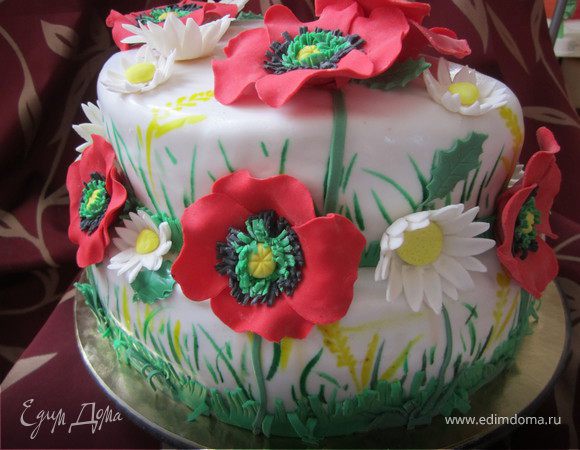 Украшение торта.
Предварительно нужно подготовить мастику зеленого цвета, часть темнее, часть светлее.
Взять пищевую краску зеленого цвета, развести капелькой водки, и тоненькой кисточкой прорисовать траву по краях ярусов.
желтой краской нарисовать колоски.
Зеленую мастику раскатать с длинные полоски, с одной стороны сделать надрезы, чтобы получилася бахрома.
Прикрепить эту бахрому по краю ярусов.