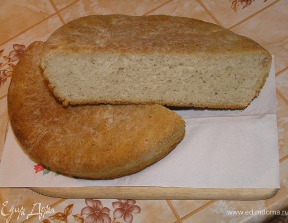 Готовый хлеб горячим вынуть из формы, сбрызнуть водой, завернуть в кухонное полотенце и положить в пакет (или накрыть фольгой и укутать полотенцем). Через 1 час можно разрезать и пробовать. Приятного аппетита!