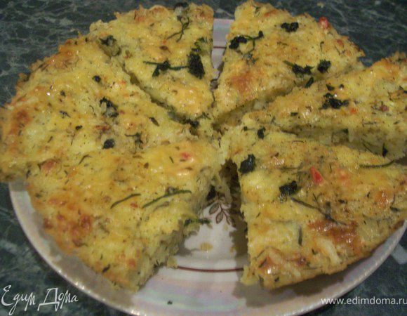 Рис заранее отварить согласно инструкции на упаковке и охладить (должно получиться 2 стакана вареного риса).Шнитт-лук мелко порубитьСливочное масло растопить. 
Соединить рис и 2 яйца, добавить шнитт-лук, посолить, поперчить, влить 1 ст. ложку растопленного масла, перемешать. 
 Добавить 100 г творога и все вымешать. 
Разъемную форму для выпечки смазать растительным маслом, равномерно распределить рисовое тесто по дну и бортикам, чтобы в центре получилось углубление, и поставить в холодильник. 
Зеленый лук мелко порезать. 
Сыр натереть на крупной терке. 
 Соединить оставшиеся яйца, творог и сливочное масло, добавить зеленый лук, треть натертого сыра, посолить, поперчить и вымешать. 
 Форму с тестом вынуть из холодильника, выложить творожную начинку, сверху присыпать оставшимся сыром. 

Выпекать 40 минут 180 градусов!)Приятного Аппетита:))
