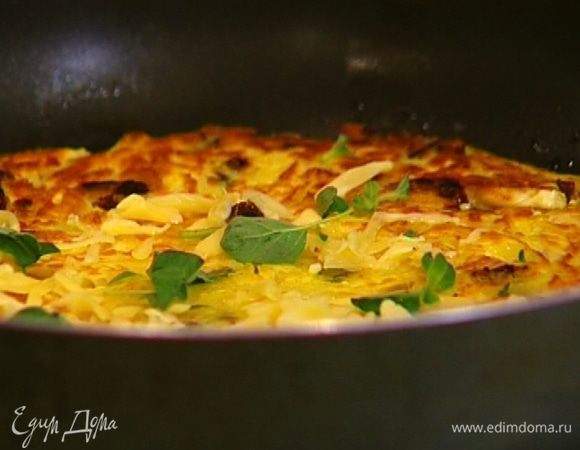 Присыпать запеканку оставшимся сыром и майораном. 