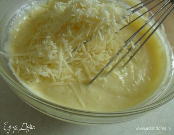 Добавить оставшееся масло( 20гр) и тертый пармезан.