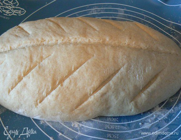 Примерно через 40 минут сделать надрезы, снова накрыть и оставить расстаиваться до увеличеня вдвое. 