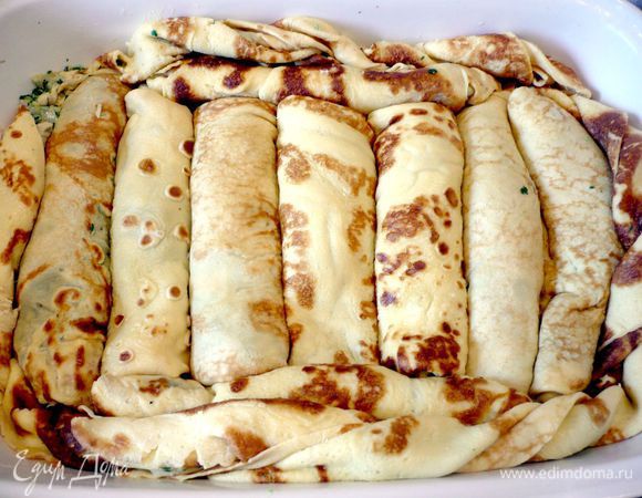 Сложить их плотно рядком в смазанную сливочным маслом форму для запекания. 