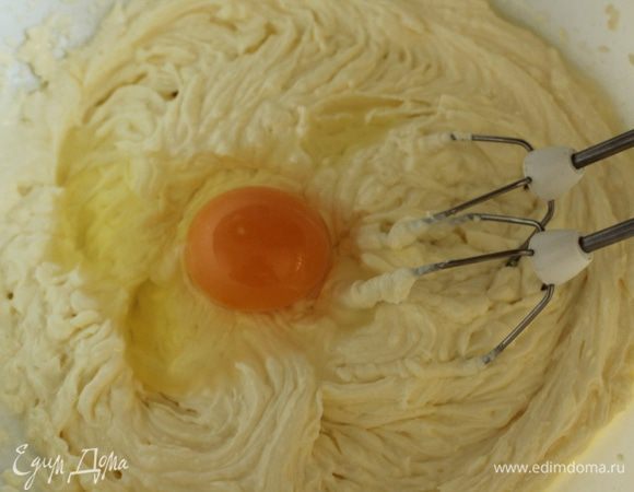 Продолжая взбивать, по одному ввести яйца.