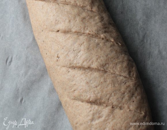 Формируем из теста батон ,оставляем в покое мин на 30,перед постановкой в печь ,делаем надрезы