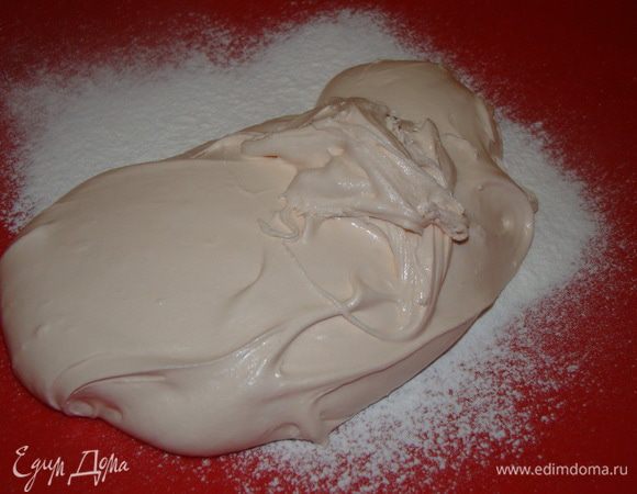 когда станет тяжело мешать - вымешивать на рабочей поверхности, как тесто, только вместо муки подпылять сахарной пудрой.