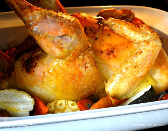 Поставить форму с цыпленком в духовку и сразу же понизить температуру духовки до 200 С. Выпекать от 1,5 ч и может быть чуть больше (до 2-х ч)... все зависит от размеров Вашего цыпленка (курицы). Проверить готовность можно, воткнув в мякоть кончик ножа..., выделяющийся из цыпленка сок должен быть светлого цвета, без крови.