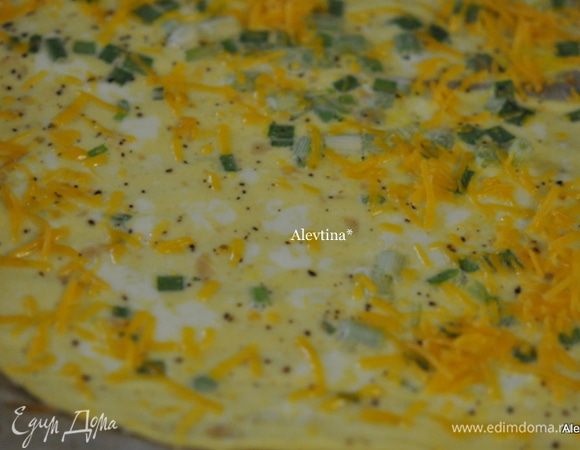 Достанем из духовку, выложим сыр протертый на терке.
