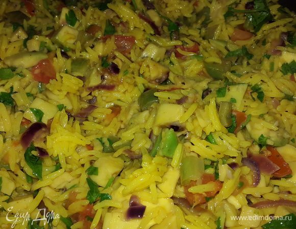 Соединяем рис с овощами, добавляем половину мелко-рубленной петрушки, перемешиваем, тушим 2 минуты и выключаем.