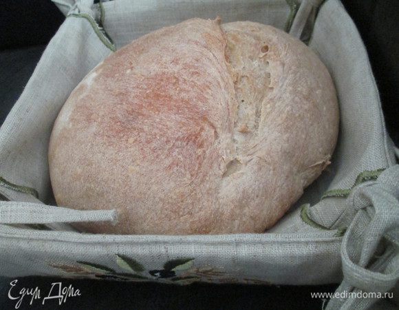 Перекладываем (переворачиваем из корзины) заготовку на противень, убавляем   температуру до 220*С и  готовим хлеб 30 минут.
Достаем наш ароматный хлебушек, даем ему полностью остынуть на решетке.