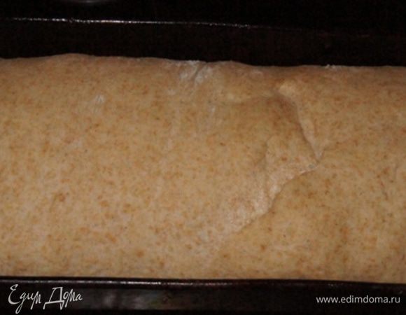 Сформировать батон. Или сделать проще, как я, уложить тесто в форму. Оставить на расстойку на 30 минут. На фото тесто после расстойки.

Духовку разогреть до 200°C. 