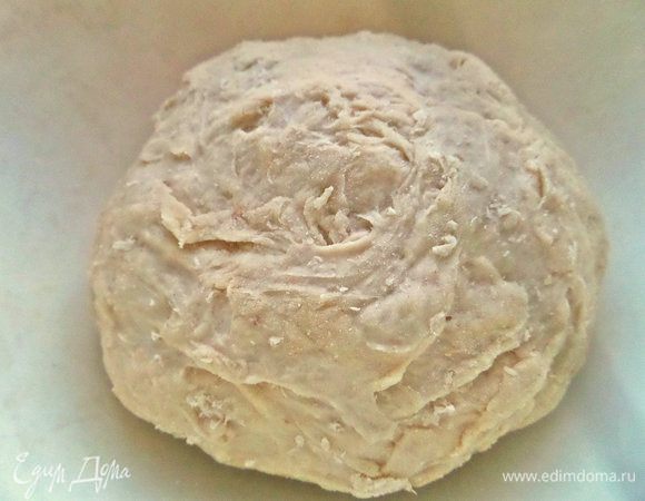 Затем вымесить руками липкое тесто.