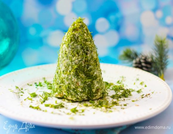 Смешать сливочный сыр Hochland, полутвердый, давленый чеснок, горчицу, грецкие орехи и табаско до однородной массы.
Охладить массу, скатав ее в шар.
Обвалять шар равномерно в мелконарезанной зелени (брать только веточки, стебли не применять). Сформовать из массы конус в виде елки. 