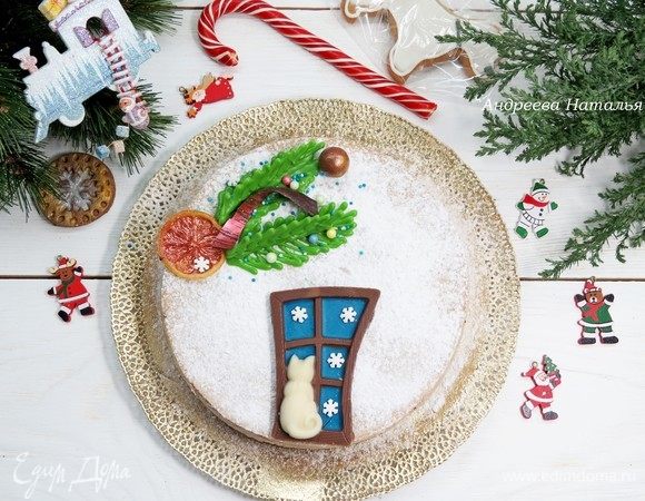 Готовый остывший чизкейк извлекаем из формы и даем охладиться в холодильнике 3–4 часа. Украшаем по желанию: у меня веточки ели из шоколада и шоколадная кошка, которую я сделала при помощи молда. 