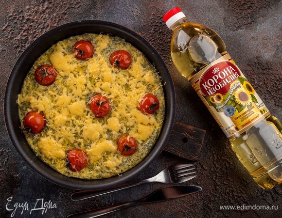 Запекайте блюдо в разогретой духовке 35 минут. При подаче посыпьте оставшимся сыром. 