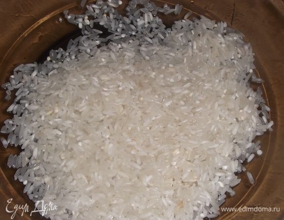 Промыть рис.