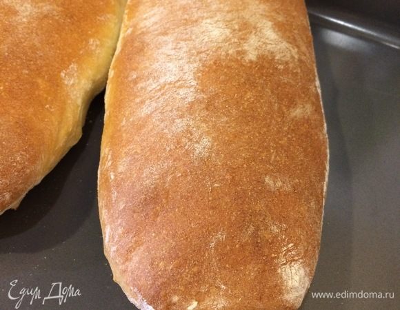 Спустя указанное время заготовки аккуратно перенести на противень и выпекать с паром при 220°C снизу и 240°C сверху 45 минут.