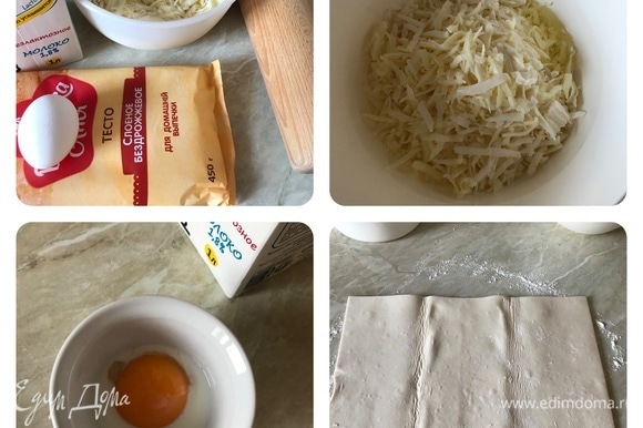 Духовку нагреть до 180°C. Сыр натереть на крупной терке, добавить яичный белок и хорошо перемешать. Стол слегка посыпать мукой и раскатать тесто в прямоугольник 40*30 см.