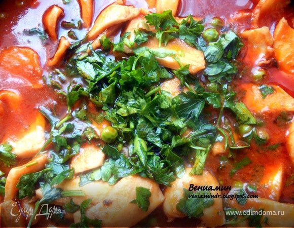 Кальмары с вином, томатами и зеленым горошком